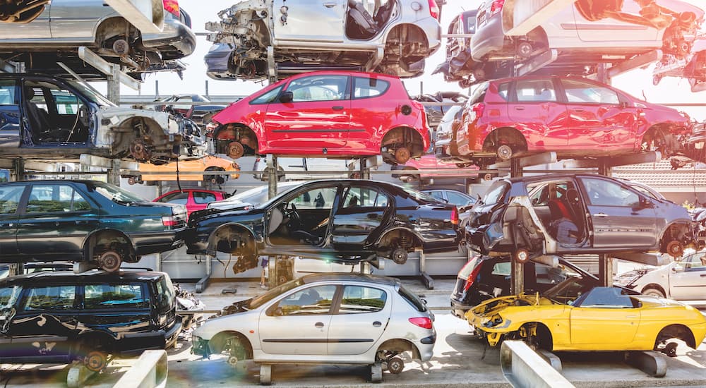 Many used cars ready for salvaging at a salvage yard