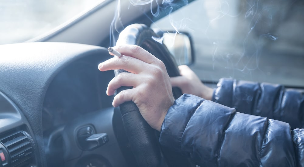 Man smoking in car