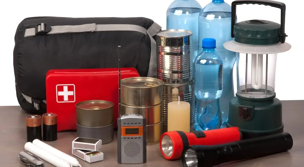 Survival kit with communication, food, and tools