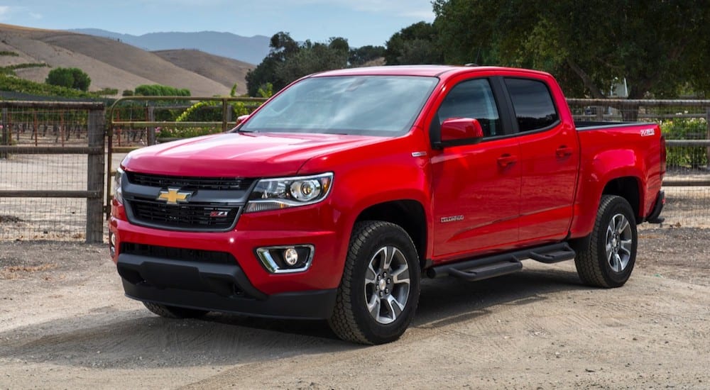 A red 2019 Chevy Colorado on a ranch, ready to work