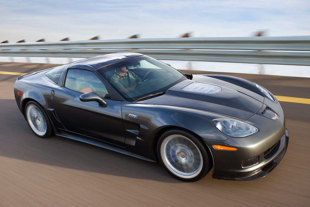 Black Chevrolet Corvette Driving Fast on the road