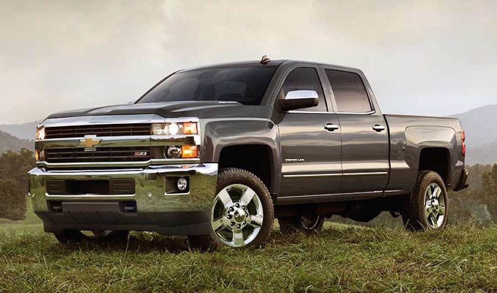 Black Chevrolet Silverado in a field