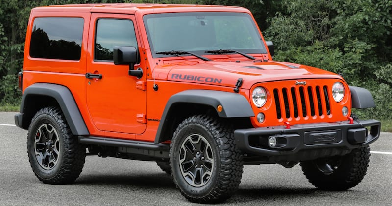 A 2016 Orange used Jeep Wrangler Rubicon is shown.