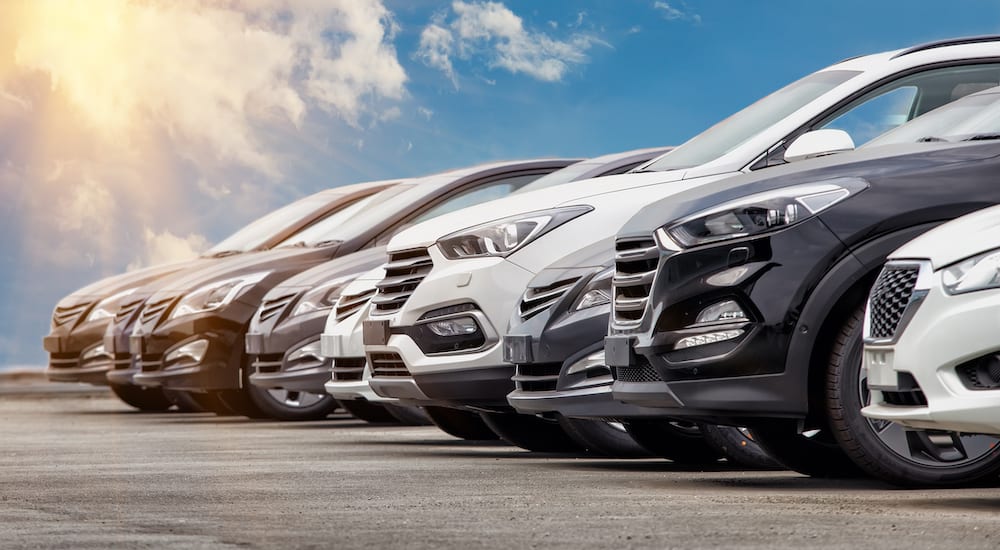 aa row of brand new cars on an outdoor lot