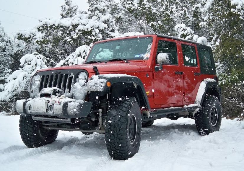 red JK unlimited snow