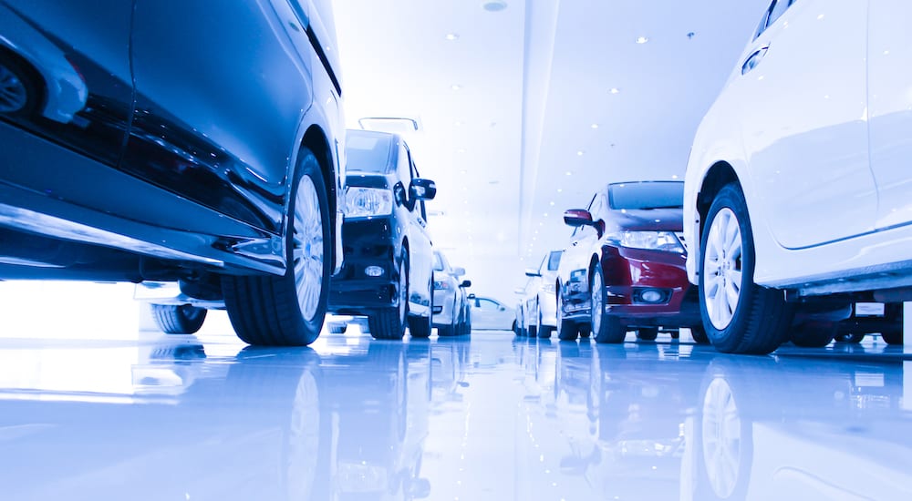 an indoor used car lot from below