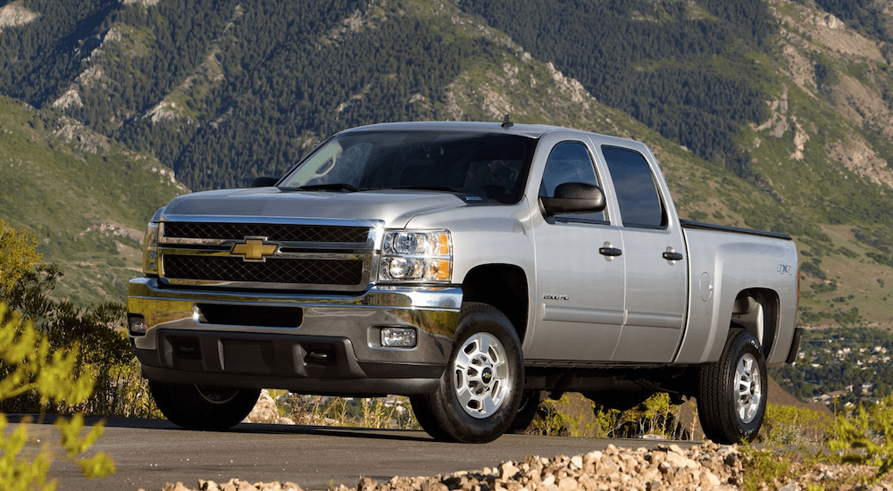 A silver 2012 Chevy Silverado 2500 on a mountain