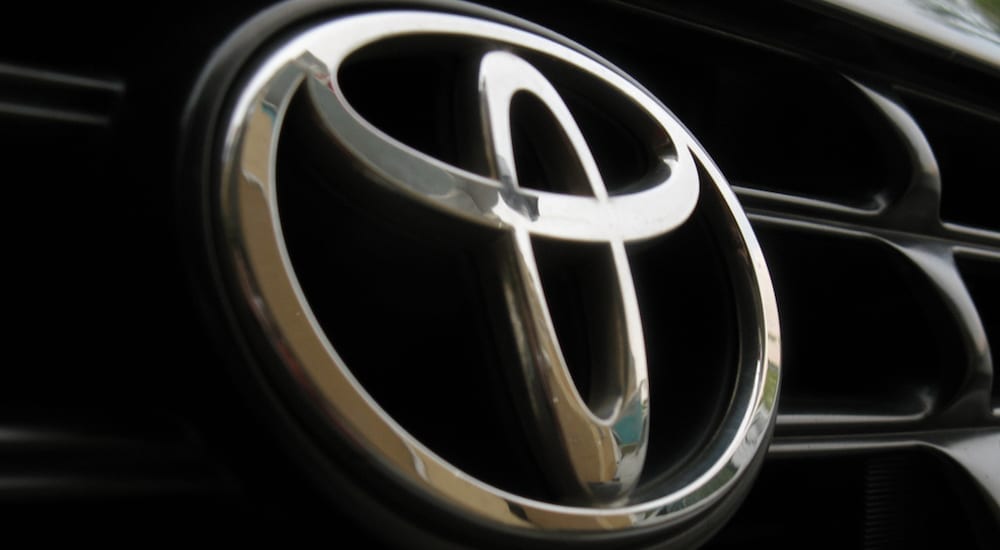 Extreme closeup of Toyota grille showing the crest/logo