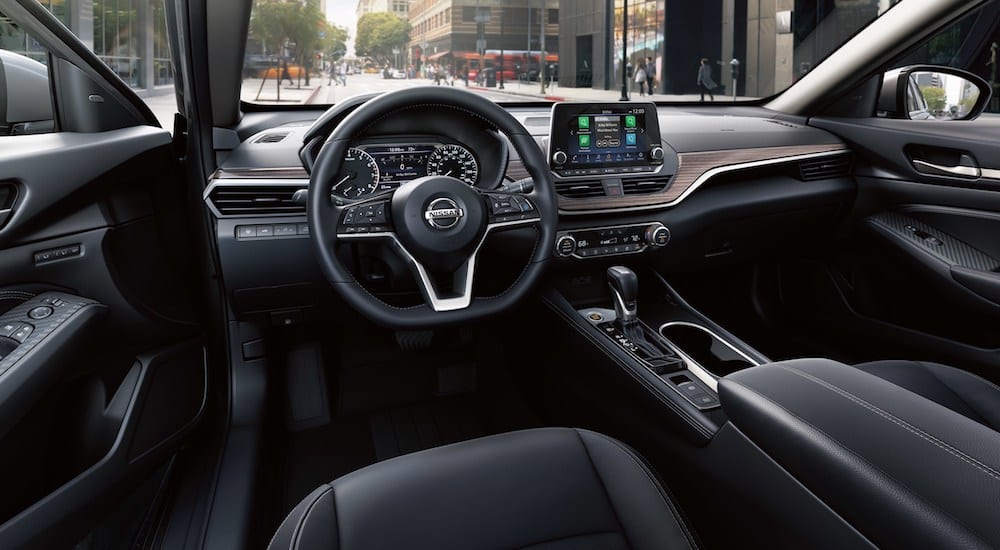 Black leather interior of 2019 Nissan Altima while in city