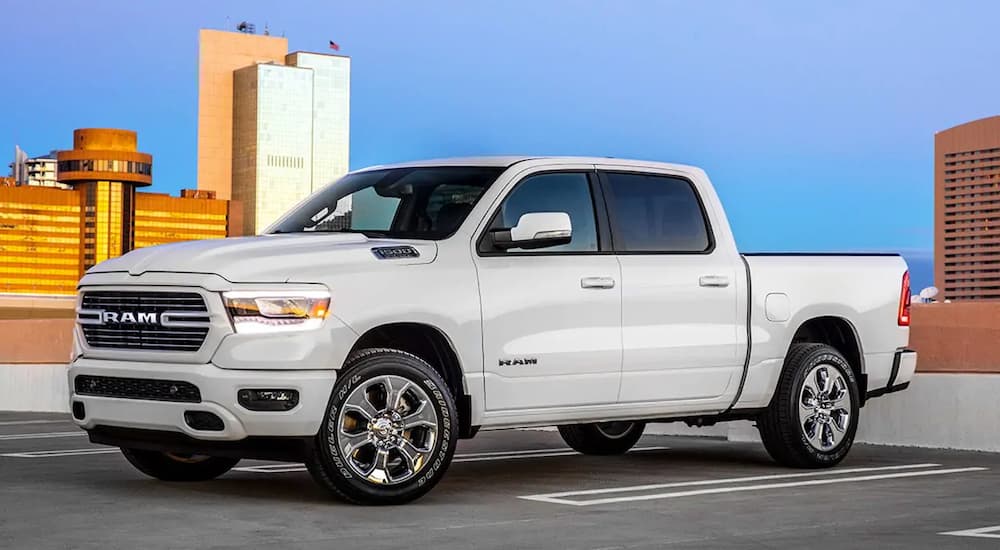 White 2019 Ram 1500 on top of parking structure in city