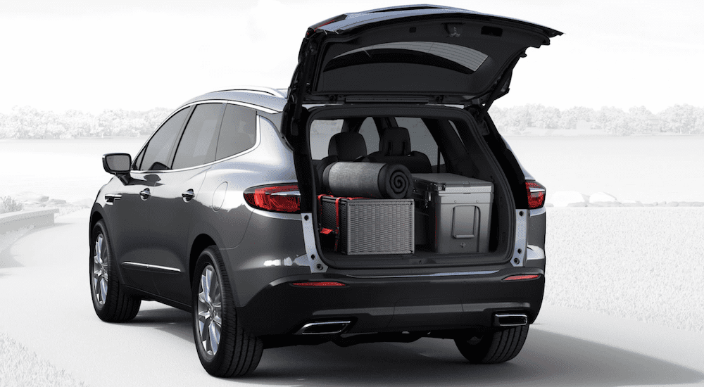 A gray 2019 Buick Enclave with the rear door open and cargo in back