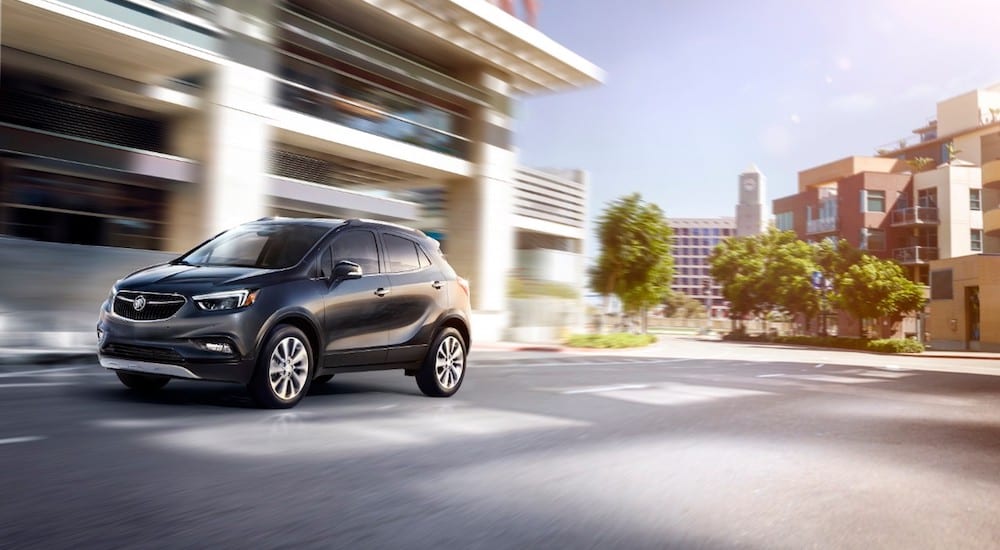 A black 2019 Buick Encore driving off with the win for 2019 Buick Encore vs 2019 Hyundai Kona
