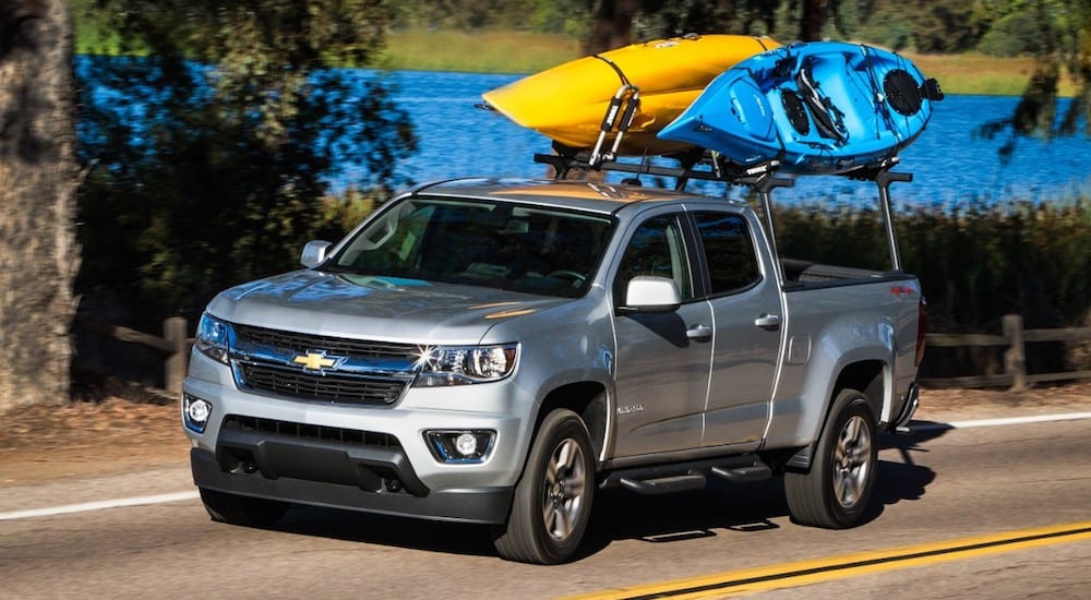A silver 2019 Chevy Colorado Z71 with kayaks on a roof rack
