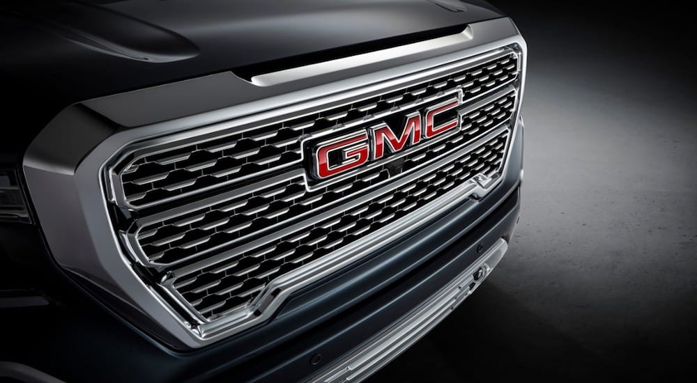 A closeup of a black 2019 GMC Sierra Denali grille