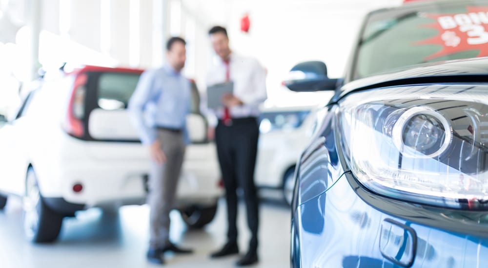 A man is buying a car at a bad credit car dealership