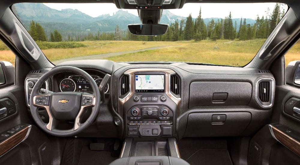 The dashboard of a 2019 Chevrolet Silverado High Country overlooking a field