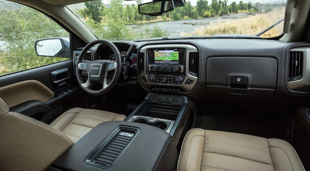 The black and white interior of the 2019 GMC Sierra Denali is shown. Check out interior options when comparing the 2019 GMC Sierra 2500HD vs 2019 Chevy Silverado 2500HD.
