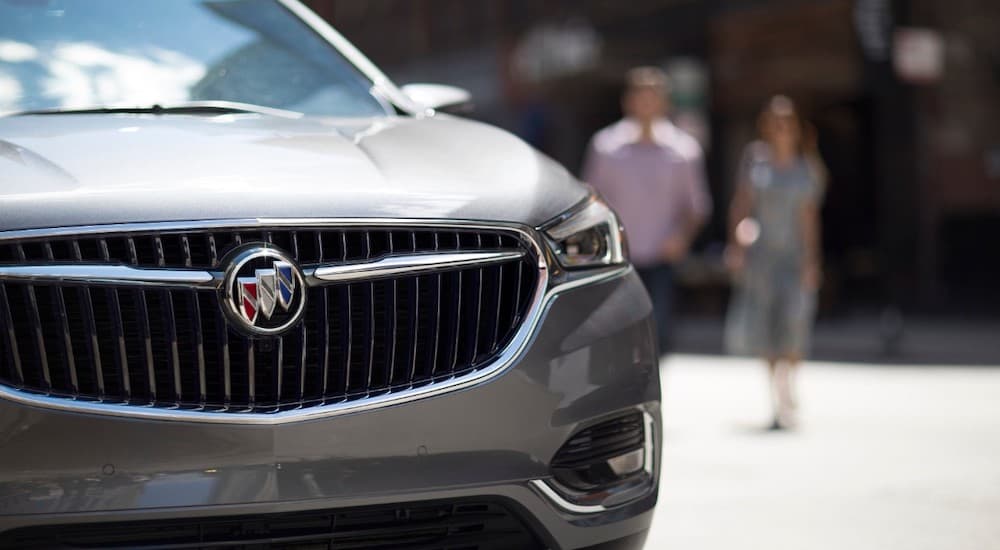 The front end of the 2019 Buick Enclave in grey is shown in a closeup. Check out style when comparing the 2019 Buick Enclave vs 2019 Dodge Durango.