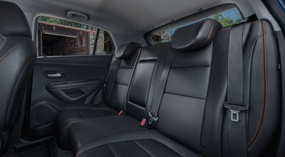 The black rear seats in a 2019 Chevy Trax are shown, which wins when comparing the 2019 Chevy Trax vs 2019 Mazda CX-3.