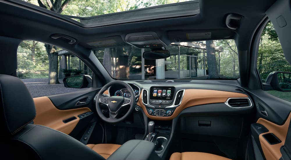 An inside look at the 2019 Chevy Equinox with black and brown leather interior is shown.