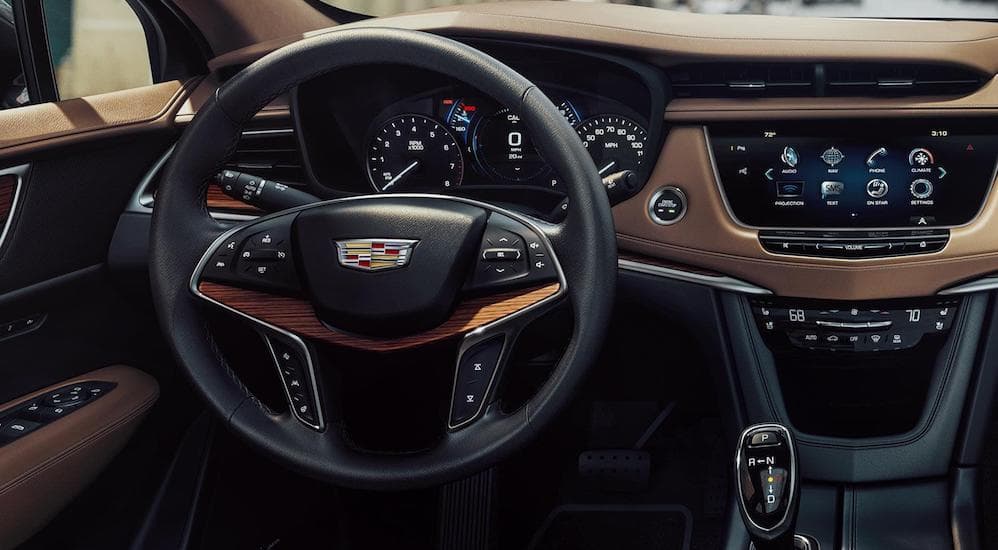 A closer look at the steering wheel controls and the 8" touch screen in a Cadillac XT5