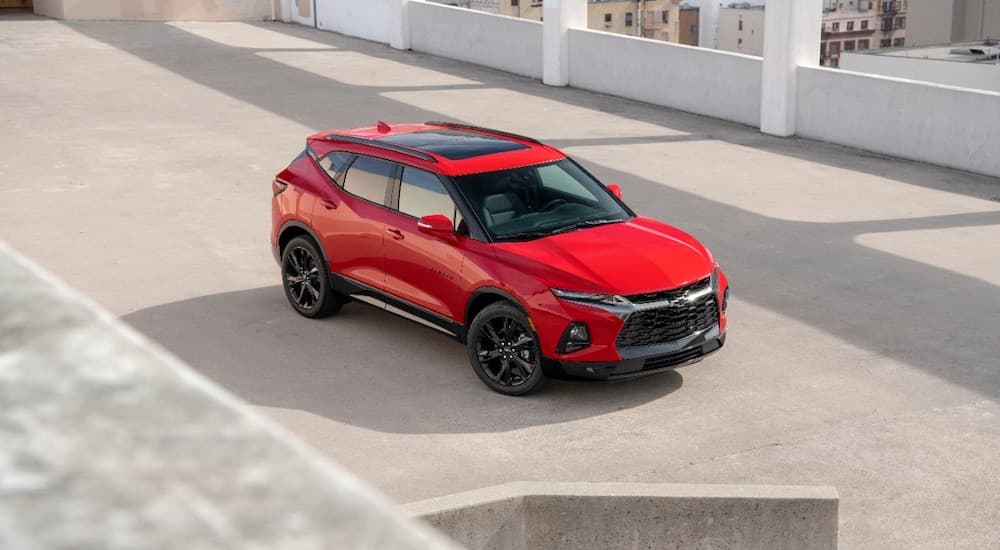 A red 2019 Chevy Blazer is on a rooftop parking area.