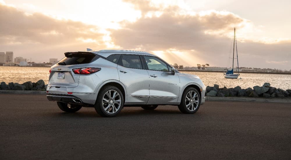 A silver 2019 Chevy Blazer is parked at a bay.
