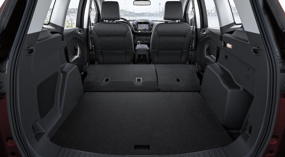 The black interior of the 2019 Ford Escape is shown from the trunk.