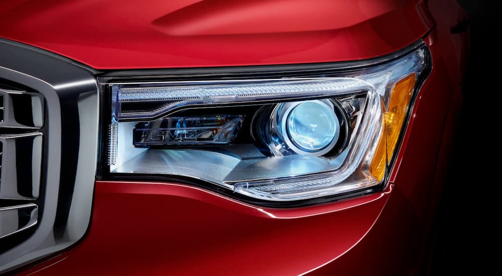 The headlight detail on the 2019 GMC Acadia is shown.