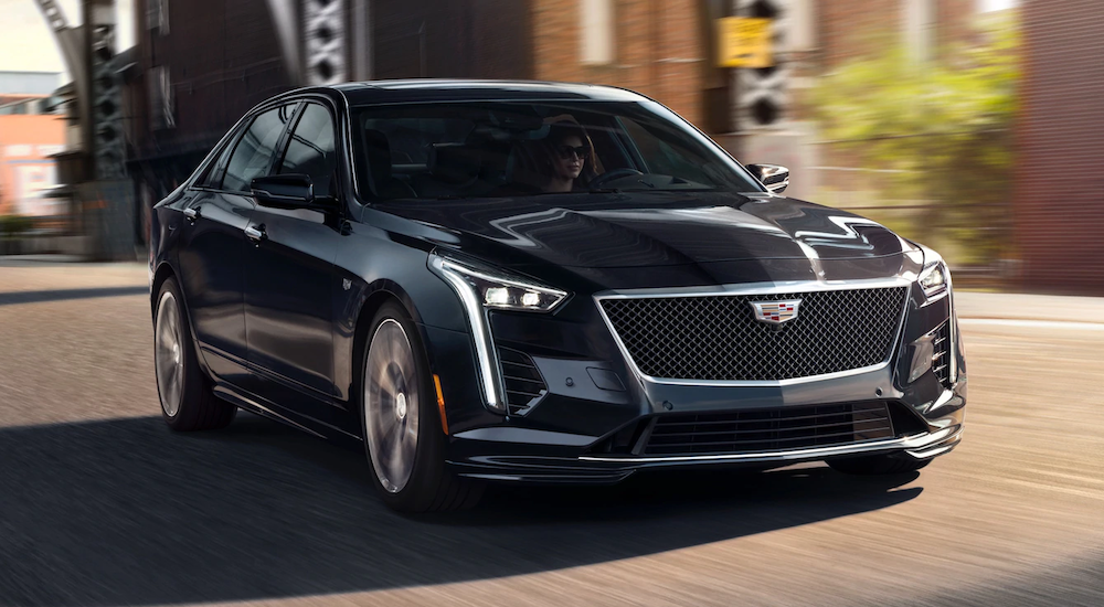 A black 2019 Cadillac CT6 is driving downtown.