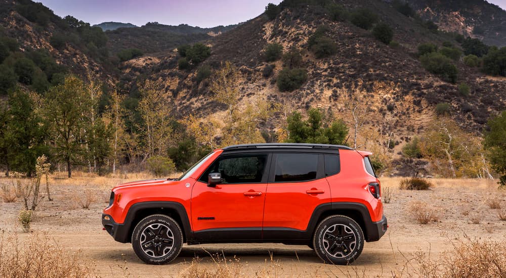 A dark orange 2016 Jeep Renegade Trailhawk is offroad.