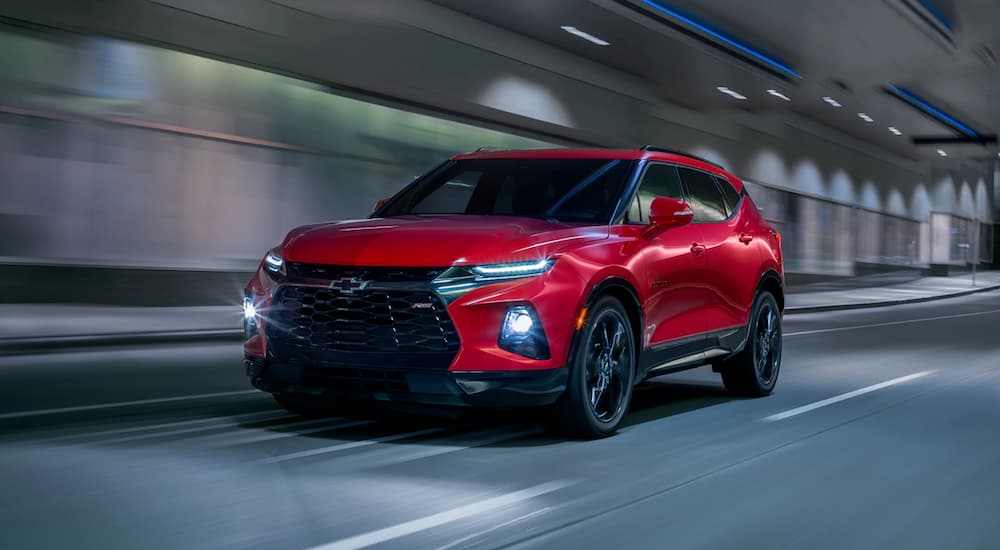 A red 2019 Chevy Blazer is driving through a tunnel.