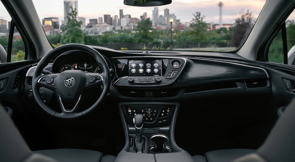 The front interior touchscreen technology of the 2020 Buick Envision is shown.