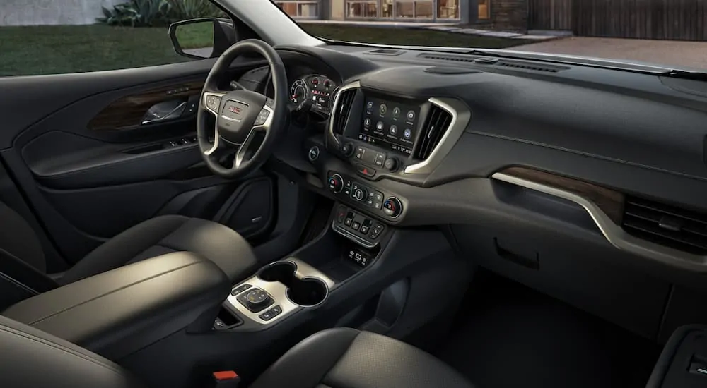The front black leather interior of a 2019 GMC Terrain Denali is shown. 