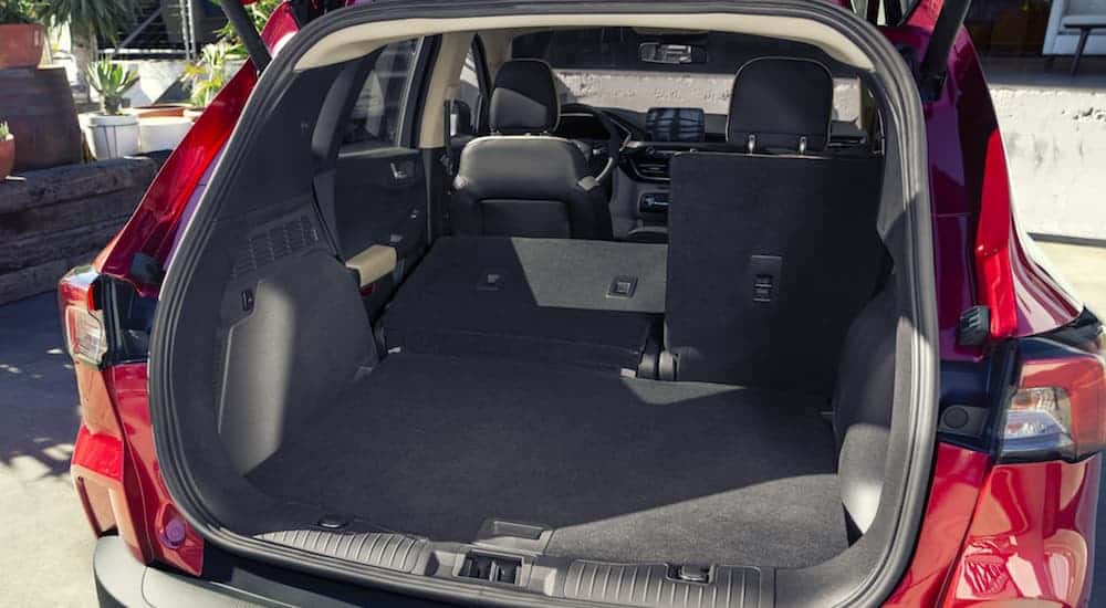 A rear to front interior look of the 2020 Ford Escape with the rear seats down is shown.