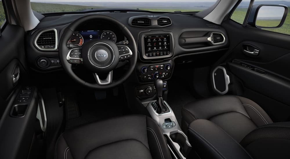 The front black leather interior of a 2020 Jeep Renegade is shown. 