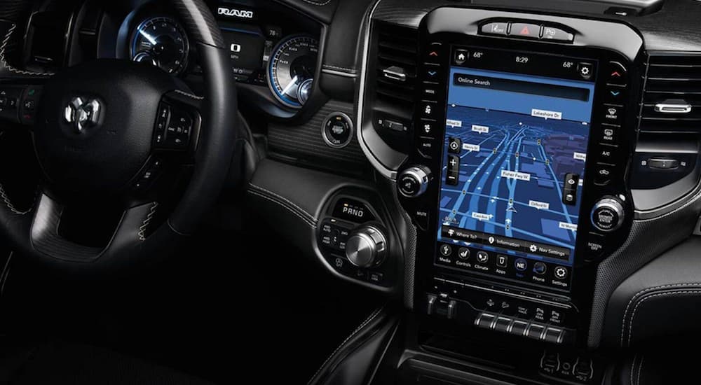 A close up look at the drivers display and the 12-Inch touchscreen inside the 2020 Ram 1500 is shown.