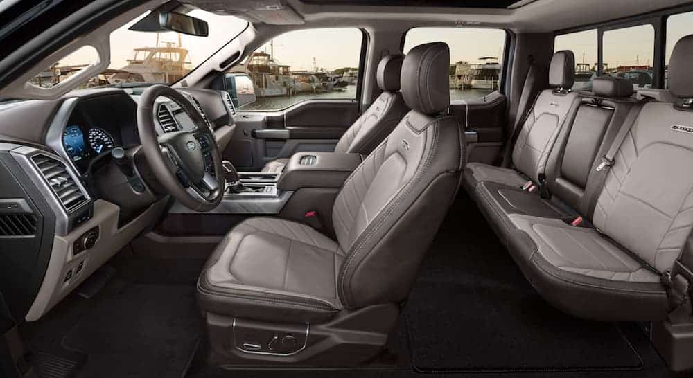 A side view of the 2020 Ford F-150 Limited interior is shown in grey and tan leather. 