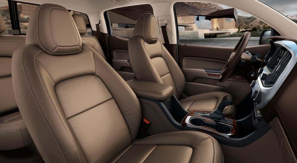 The front brown leather interior of a 2020 GMC Canyon SLE.
