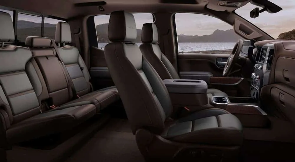 A side view of the brown and black leather interior of a 2020 GMC Sierra 1500 is shown.