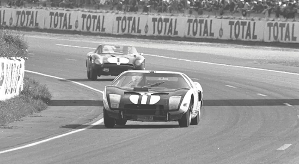A Ford GT40 is racing a 24 hour race in the mid 1960's.