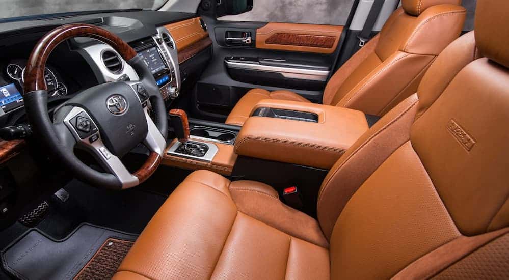 Brown leather seats are shown in a 2017 Toyota Tundra.