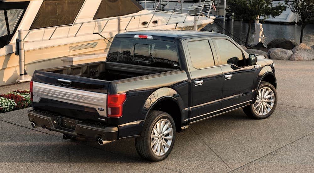 A birds eye view of a black 2020 Ford F-150 that's parked at a boat dock is shown.