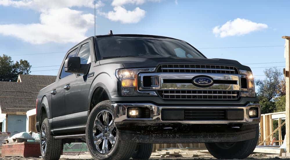 A gray 2020 Ford F-150 is parked at a construction site. 