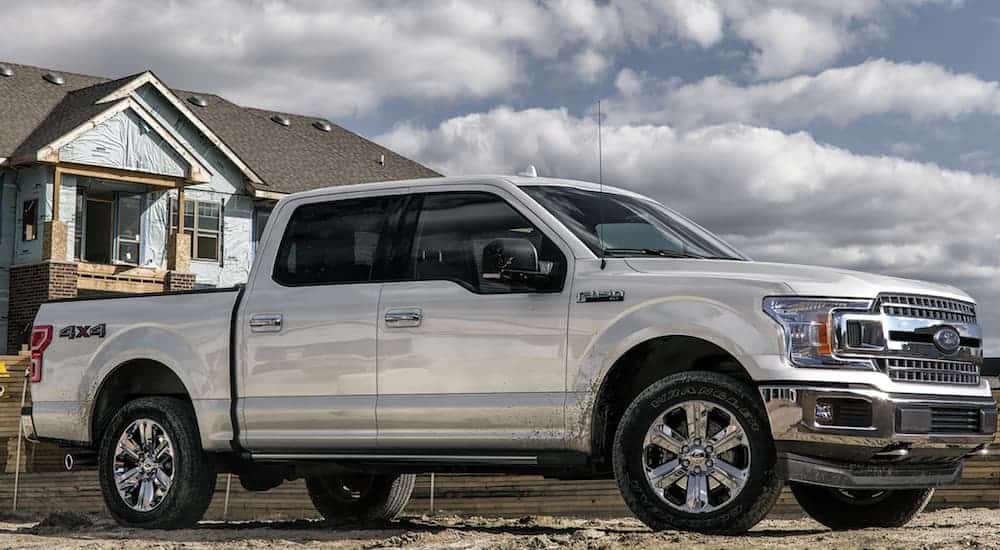 A silver 2020 Ford F-150 is parked at a construction site.