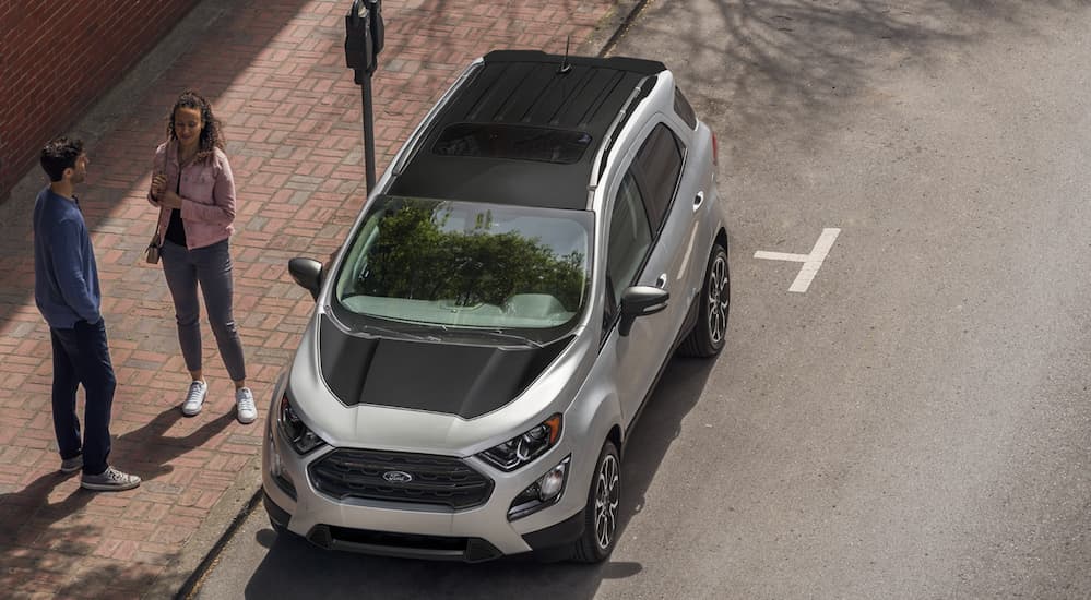 A birds eye view of a silver and black 2020 Ford Ecosport is parked on the side of a street.