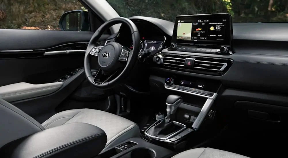 The black interior of a 2021 Kia Seltos is shown.