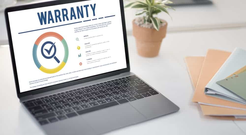 A laptop is shown with warranty coverage on it. 