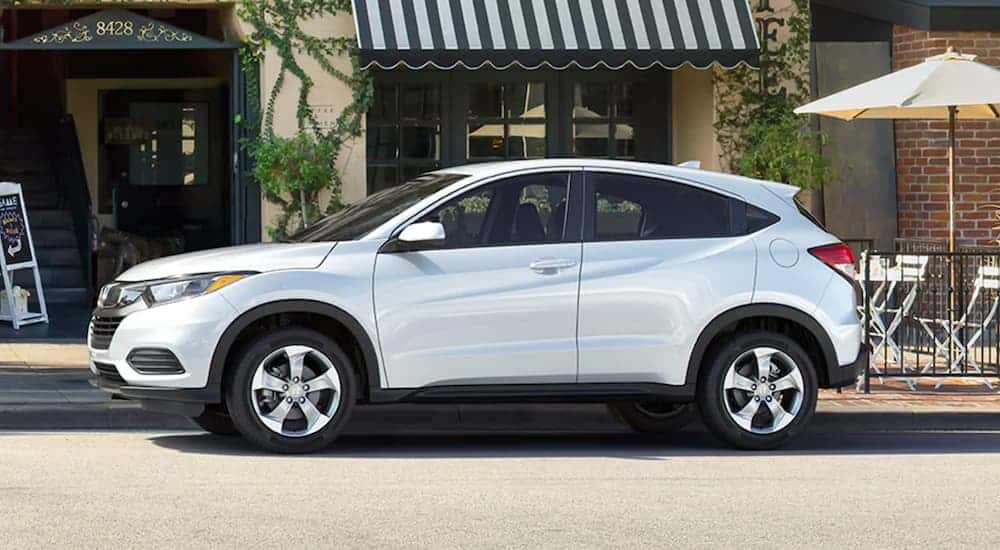 A white 2020 Honda HR-V is parked in front of a cafe.