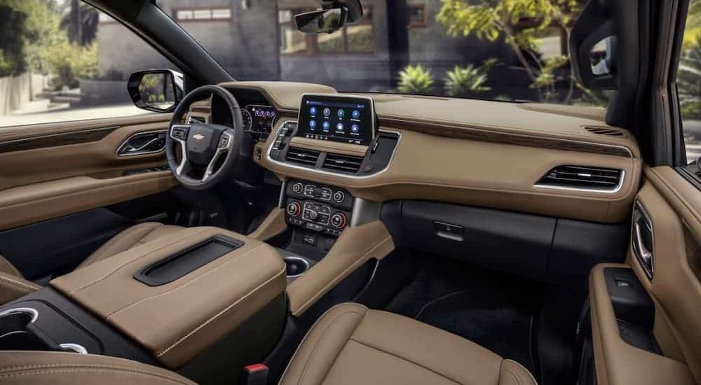 The tan interior of a 2021 Chevy Suburban is shown.